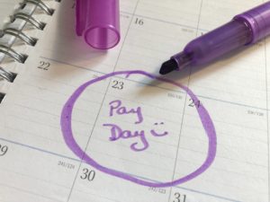 Calendar date circled in purple with the words pay day written